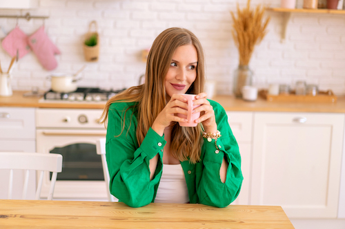 Woman drinking her coffee after cleaning