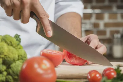 Chef knife cutting vegetables