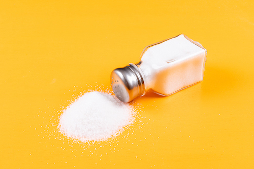 Salt shaker spilled with salt