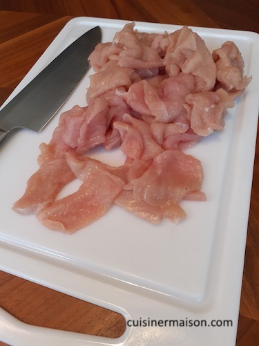 Cutting meat on a kitchen board