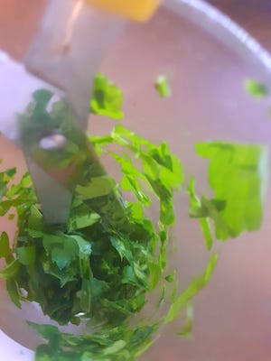 Cut parsley into a glass
