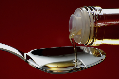 Pour oil into a spoon