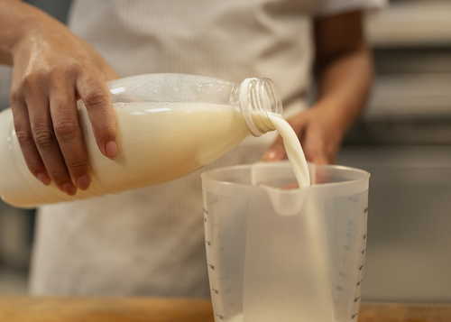 milk-poured-in-meter-glass
