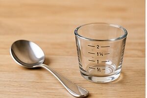 How many tablespoons in an ounce
